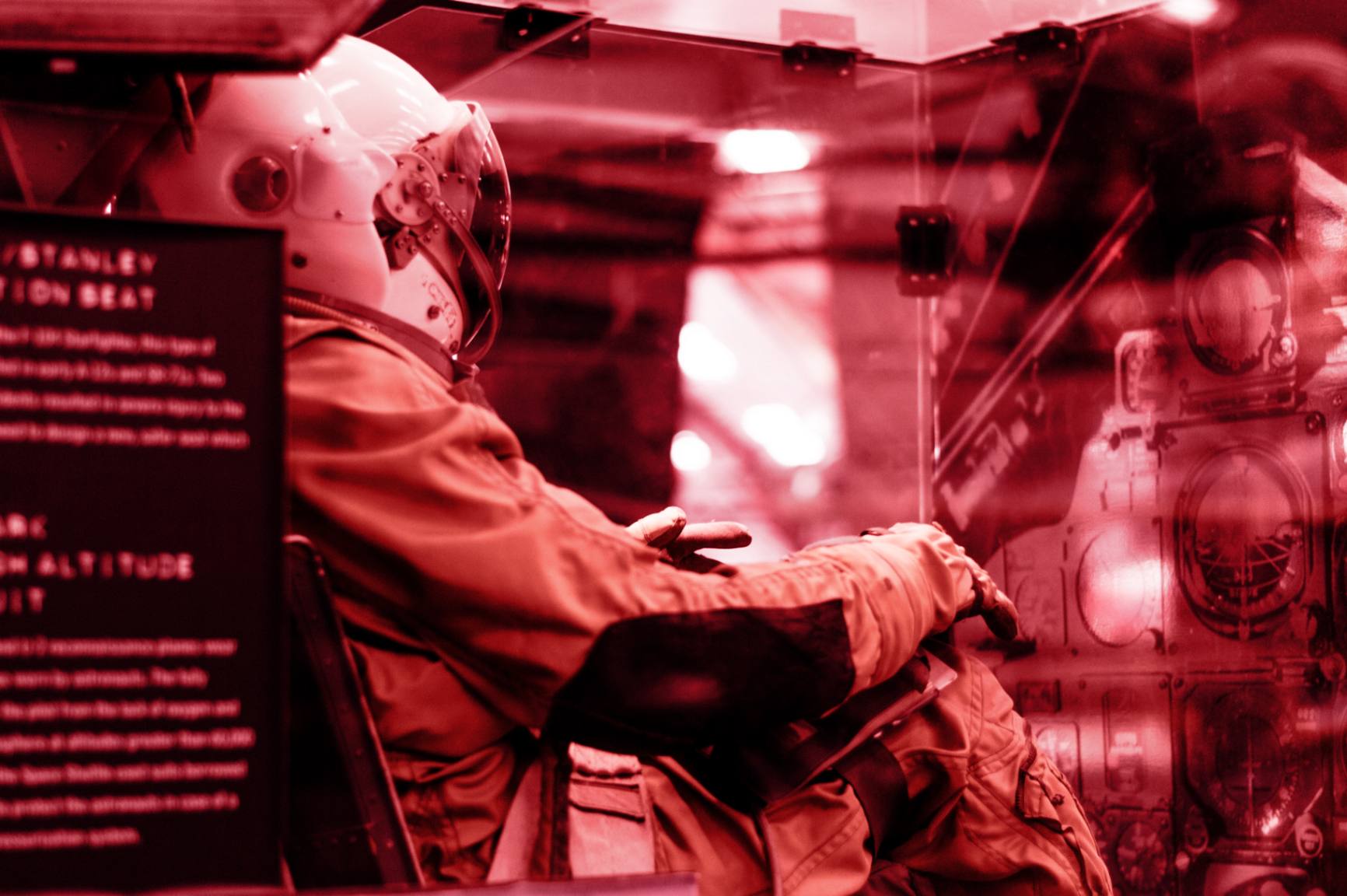 a person wearing an astronout suit inside a testing machine.